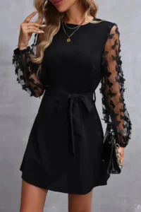 Black dress with sheer embellished sleeves, featured in the September dress giveaway